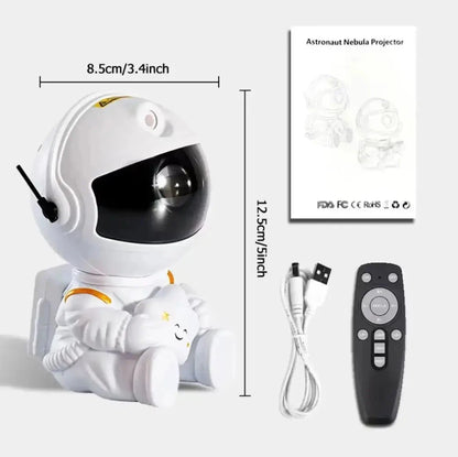 Lampe astronaute blanche avec dimensions indiquées de 8,5 cm de large et 12,5 cm de haut, accompagnée d’un câble USB, d’une télécommande noire et d’une notice